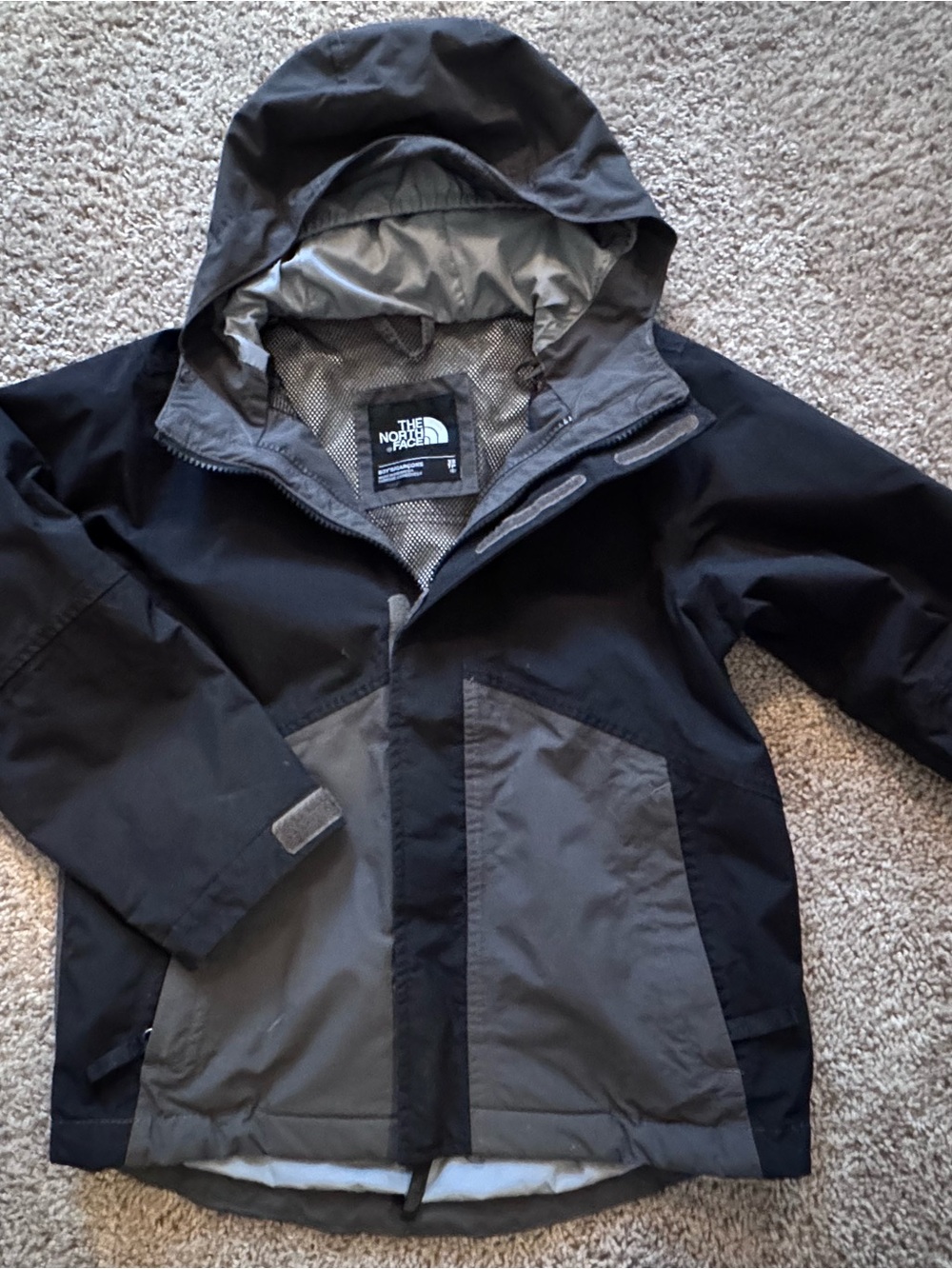 The North Face boys Black and Gray Hooded Raincoat